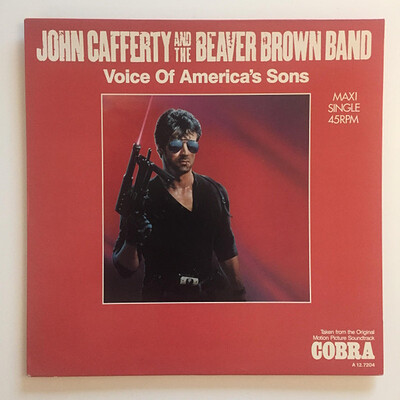 JOHN CAFFERTY AND THE BEAVER BROWN BAND - VOICE OF AMERICA'S SON Dutch 12" maxi, promo stamped. From the Sylvester Stallone film "Cobra" (12")