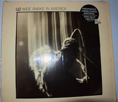 U2 - WIDE AWAKE IN AMERICA U.S. pressing, in shrinkwrap with original sticker on front (LP)