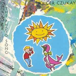 CZUKAY, HOLGER - THE PHOTO SONG / Das Massenmedium UK single from 1984. (7")